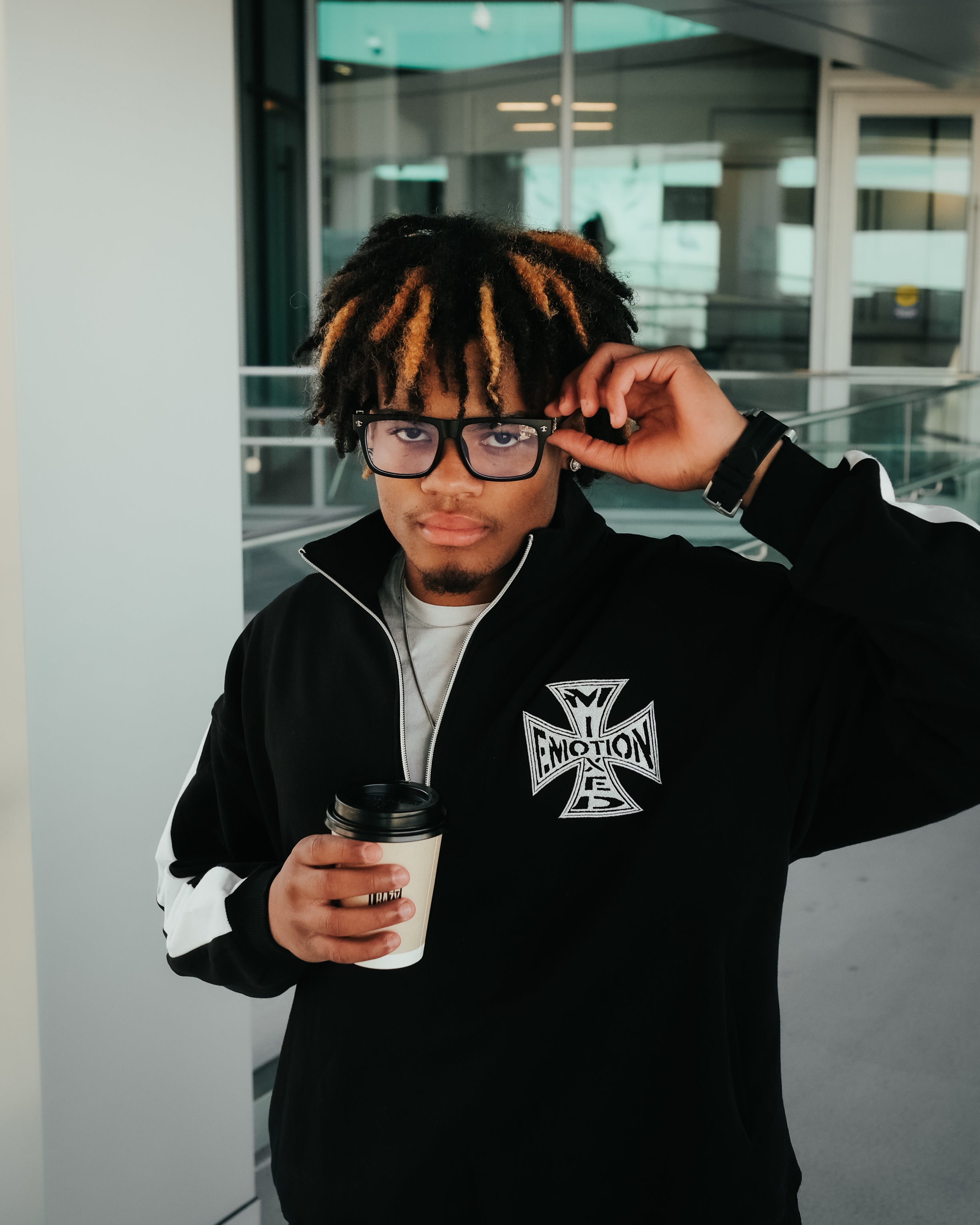 Black “Quarter” zip Jacket
